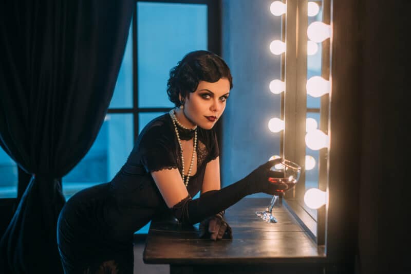 Pretty,Flapper,Girl,With,Wineglass.,Old,Photo,In,A,Retro